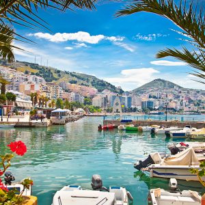 Scenic waterfront with boats and flowers